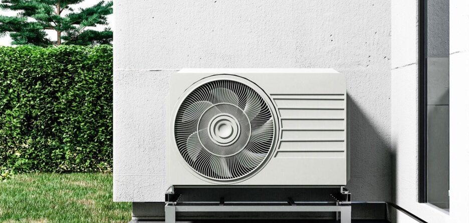 close-up heat pump placed outside a house